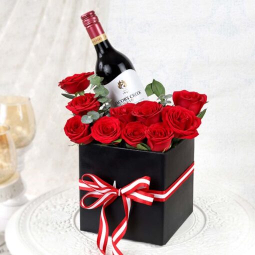 Rosé Wine Floral Delight bouquet featuring blush roses with wine-themed accents