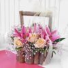 Rustic Rose Lily Basket featuring a beautiful mix of fresh roses and lilies arranged in a rustic wooden basket with greenery, ideal for elegant gifting.