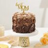 Rosy Cocoa Elegance Cake – chocolate cake adorned with handcrafted buttercream roses and floral textures
