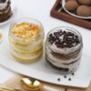 Scotch Chip Cake Duo showcasing two jars filled with fusion-style scotch chip cake layers and creamy frosting, ideal for dessert lovers.