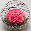 Blissful Pink Roses Vase – soft pink roses and miniature carnations arranged in a clear glass vase with greenery.