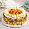 Fresh Fruit Delight Cake – layered cake decorated with colorful fresh fruits and whipped cream