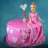 Royal Barbie Fondant Cake – Barbie doll cake decorated with pink and white fondant dress and edible decorations.