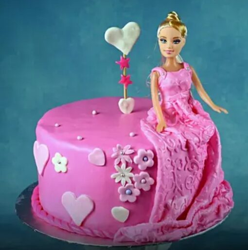 Royal Barbie Fondant Cake – Barbie doll cake decorated with pink and white fondant dress and edible decorations.