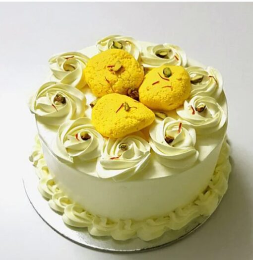 Saffron Rasmalai Cake – layered cake with saffron-infused cream, pistachios, and rose petals