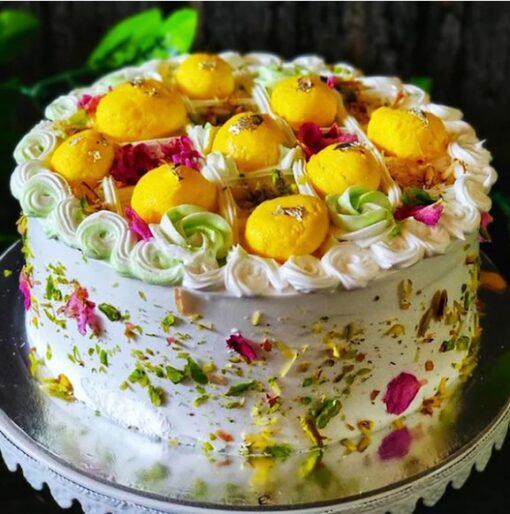 Rosy Pistachio Rasmalai Delight – cake decorated with pistachios and rose petals
