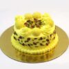 Pistachio Rasmalai Cream Cake – layered cake with pistachio cream, saffron, and rose petal garnish