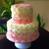 Elegant Rose Blossom Cake – cake decorated with delicate buttercream roses in soft pink and white.