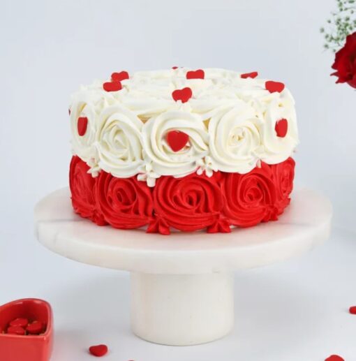 Divine Rosy Delight Cake – heart-shaped cake decorated with buttercream roses and rose water frosting.