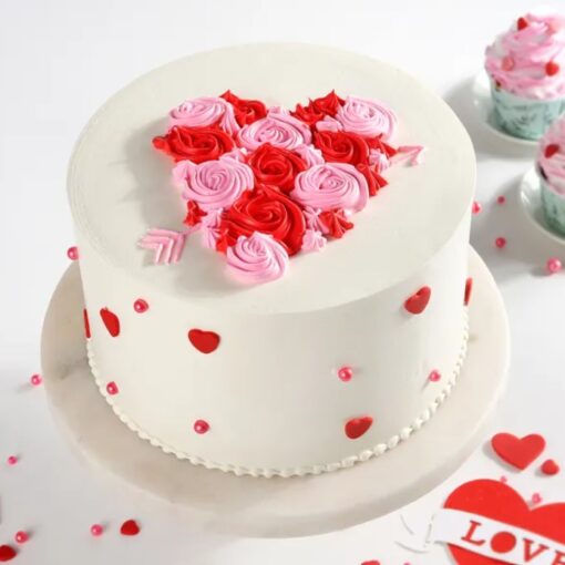 Heart of Roses Cake – heart-shaped cake decorated with red and pink buttercream roses.