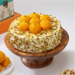 Motichoor Ladoo Delight Cake – fusion cake decorated with motichoor ladoos and creamy frosting.
