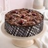 Cherry Black Forest Cake – chocolate sponge layers with cherry filling and whipped cream, topped with cherries and chocolate shavings.