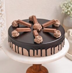 Decadent Kitkat Delight Cake – chocolate cake with Kitkat bars and creamy frosting