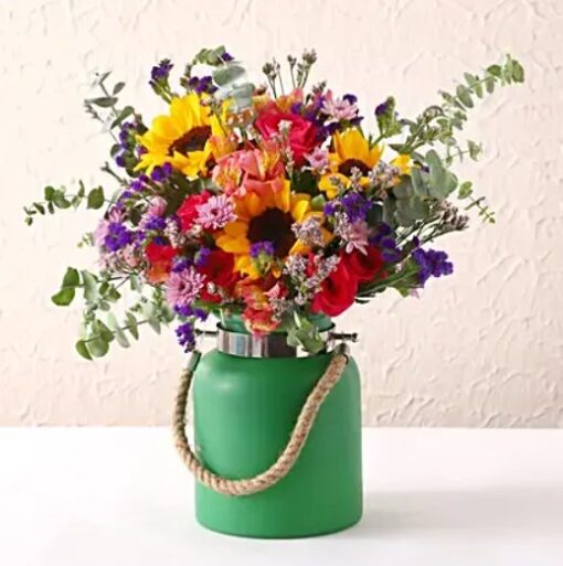 Delightful Floral Green Jar – mixed fresh flowers arranged in a green decorative jar