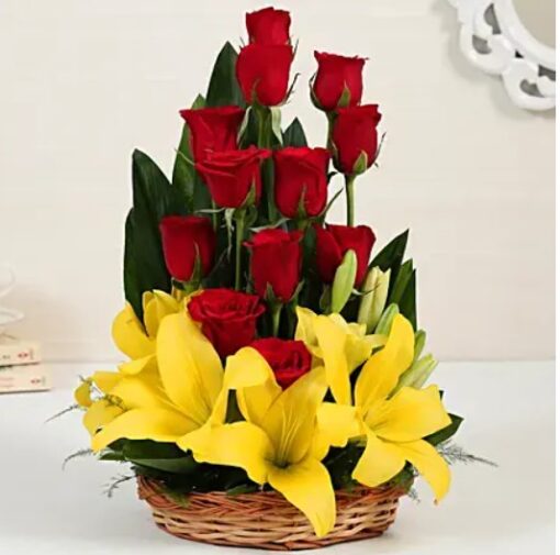 Elegant Lilies Roses Basket – fresh lilies and red roses arranged beautifully in a basket.