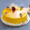 Glazed Mango Delight Cake with shiny mango glaze and moist mango-infused sponge.