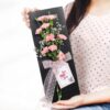 Carnation Slate for Mom featuring elegant pink and white carnations arranged on a slate base