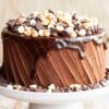 Signature Coffee Cake with coffee-infused sponge layers and smooth creamy frosting decorated elegantly.