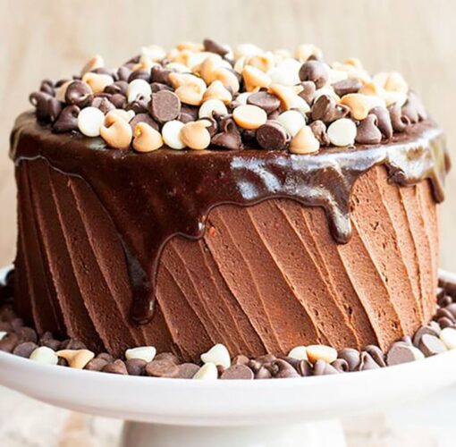 Signature Coffee Cake with coffee-infused sponge layers and smooth creamy frosting decorated elegantly.
