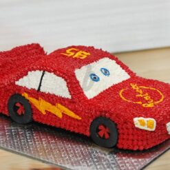 Luxury sports car cake with sleek fondant design and racing details.