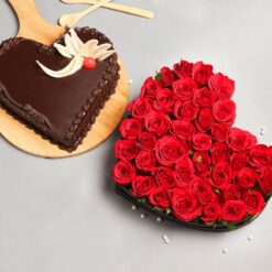 Heartfelt Cake & Floral Duo featuring a heart-shaped cake and a vibrant flower bouquet, beautifully arranged for gifting.