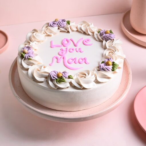 Loving Vanilla Tribute Cake – elegant vanilla cake with smooth frosting and delicate decorations.