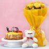 Gift combo with butterscotch cake, teddy bear, and fresh flowers arranged in a box, ideal for birthdays, anniversaries, and romantic surprises.