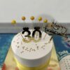 Elegant 30th birthday cake with floral decorations and golden accents