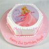 Princess Barbie Cake decorated with pink frosting, fondant gown, and a Barbie doll centerpiece.