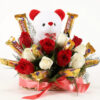 Basket of fresh red roses with assorted chocolates arranged elegantly