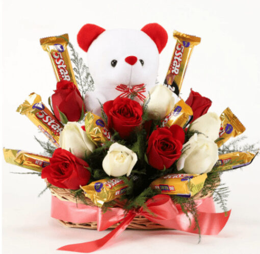 Basket of fresh red roses with assorted chocolates arranged elegantly
