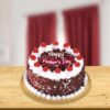 Dad’s Favorite Black Forest Cake decorated with cherries and whipped cream.