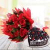 Black Forest cake decorated with a bouquet of red roses.