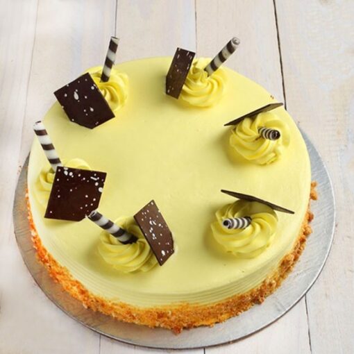 Butterscotch cake with chocolate stick topping and caramel crunch, ideal for dessert lovers and special celebrations.