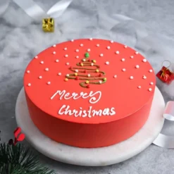 Assorted Flavor Christmas Cake with layers of fruit, nuts, and festive holiday decorations