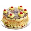 Cherry-Kissed Butterscotch Cake—elegant butterscotch cake topped with juicy cherries and floral accents.