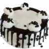 Elegant vanilla bean cake generously studded with chocolate chips and possibly floral accents.