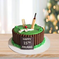 Cricket Match Decor Cake – cake decorated with cricket bats, balls, wickets, and field design