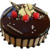 Chocolate Mousse Cake with glossy ganache and chocolate shavings.