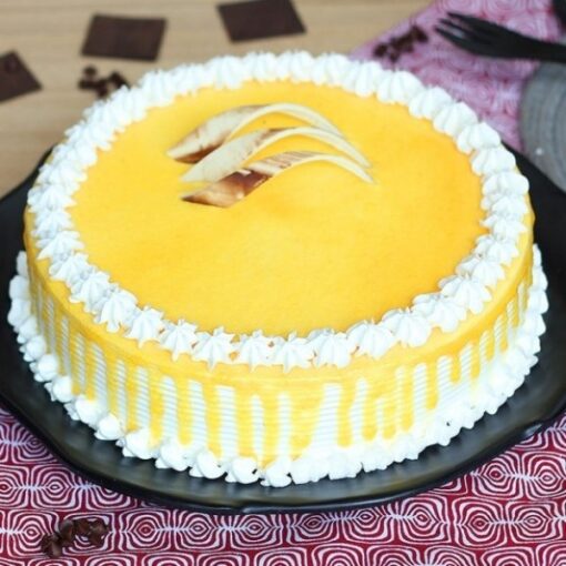 Silken Butterscotch Fantasy—elegant butterscotch cake with silky cream and floral accents.