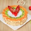 Designer heart-shaped red velvet cake with elegant decorative accents.