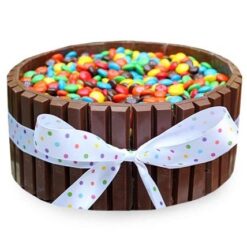 Crunchy Kitkat Celebration Cake – chocolate cake decorated with Kitkat bars and creamy frosting.