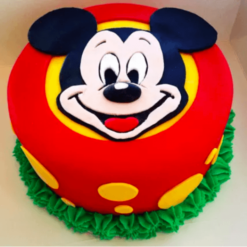 Mickey Magic Cake—colorful Micky Mouse themed birthday cake with playful decorations..