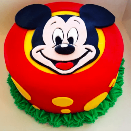 Mickey Magic Cake—colorful Micky Mouse themed birthday cake with playful decorations..