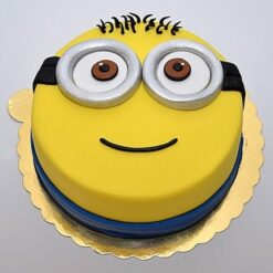 Trendy Minion Birthday Cake decorated with bright yellow and blue fondant and Minion character figures.