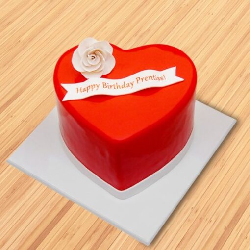 Custom Designer Celebration Cake with personalized decorations and elegant floral accents.