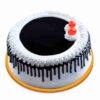 Noir Forest Elegance Cake featuring rich chocolate layers, cherries, and elegant floral decorations.