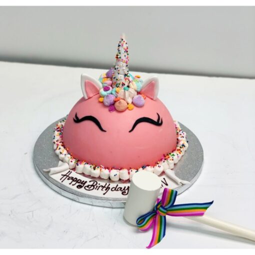 Unicorn Piñata Surprise Cake – colorful unicorn cake with candy-filled piñata center.