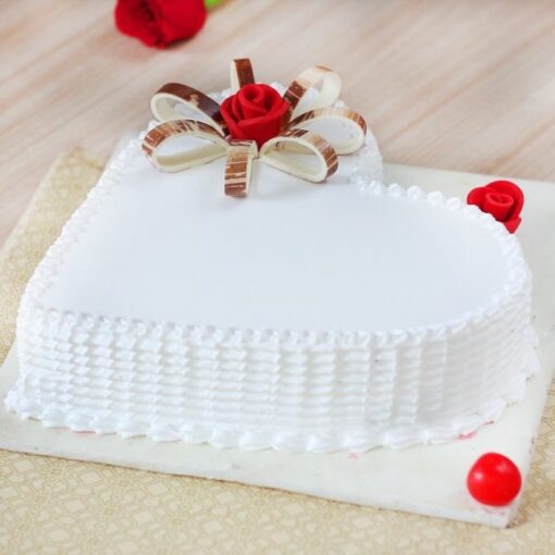 Vanilla Heart Delight Cake with heart shape and vanilla flower decorations.