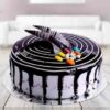 Experience the refined taste of Gemstone Vanilla Delight—a moist vanilla cake adorned with gemstone-inspired decorations.